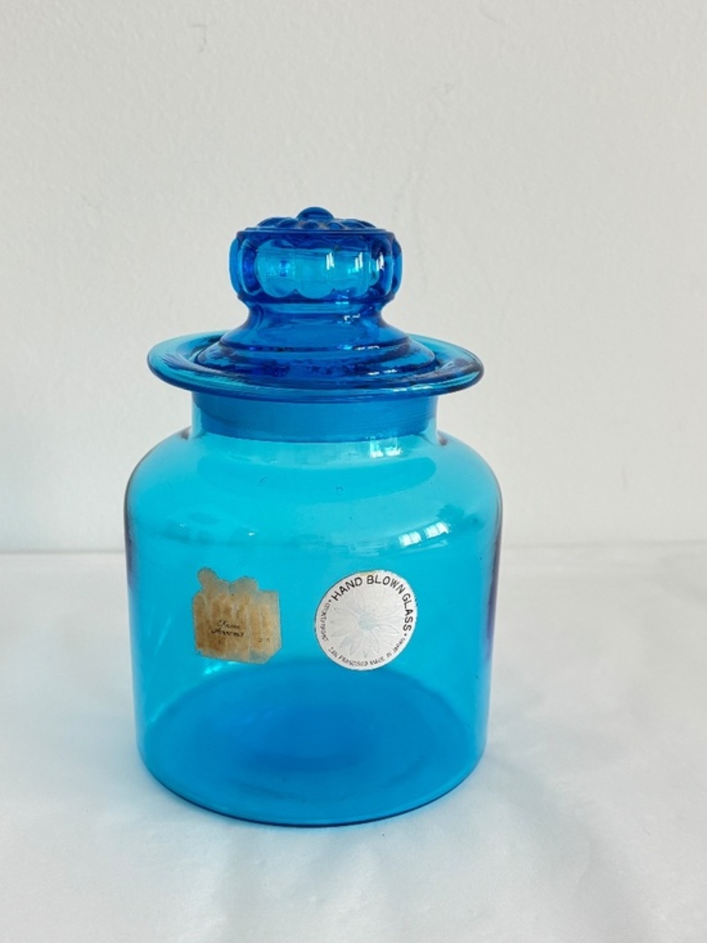 Vintage Mid century apothecary jar with daisy shaped lid hand blown blue glass
